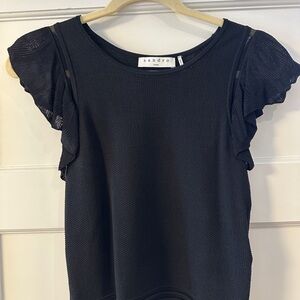 Black stretchy blouse with flounce